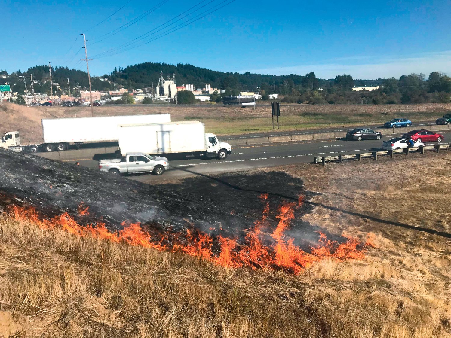 A brush fire broke out alongside Interstate 5 near Exit 77 in Chehalis on Tuesday.
